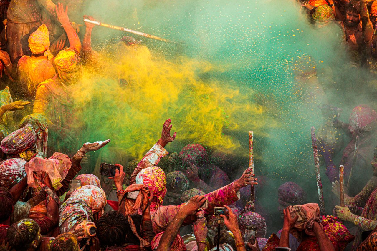 Holi festival celebration in India with clouds of colourful powder in the air