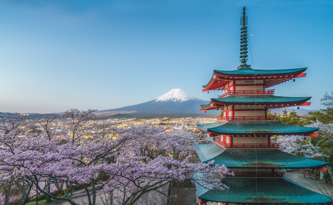 Chureito Pagoda with Mount Fuji and cherry blossoms at dusk, Japan